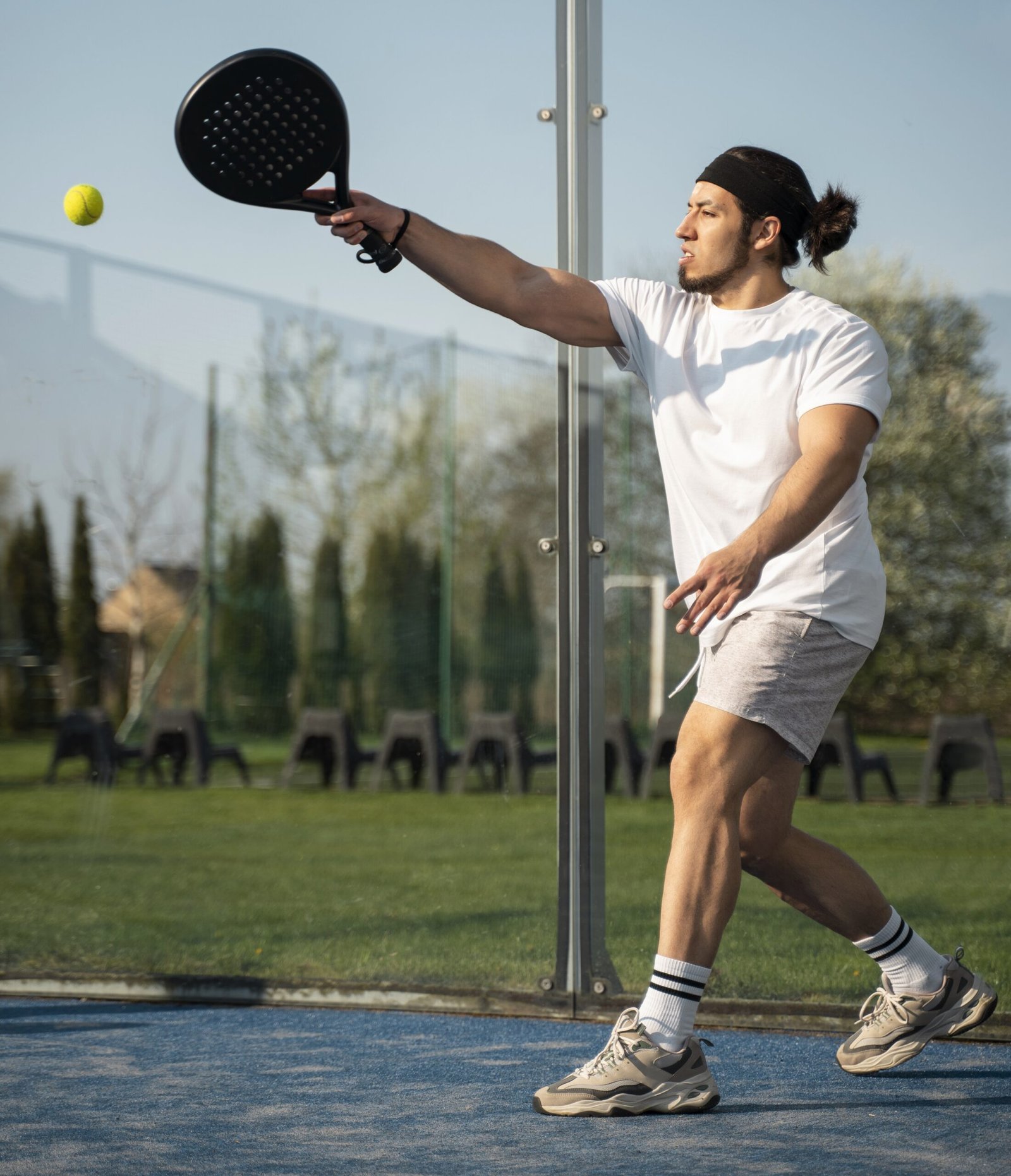 side-view-man-playing-paddle-tennis